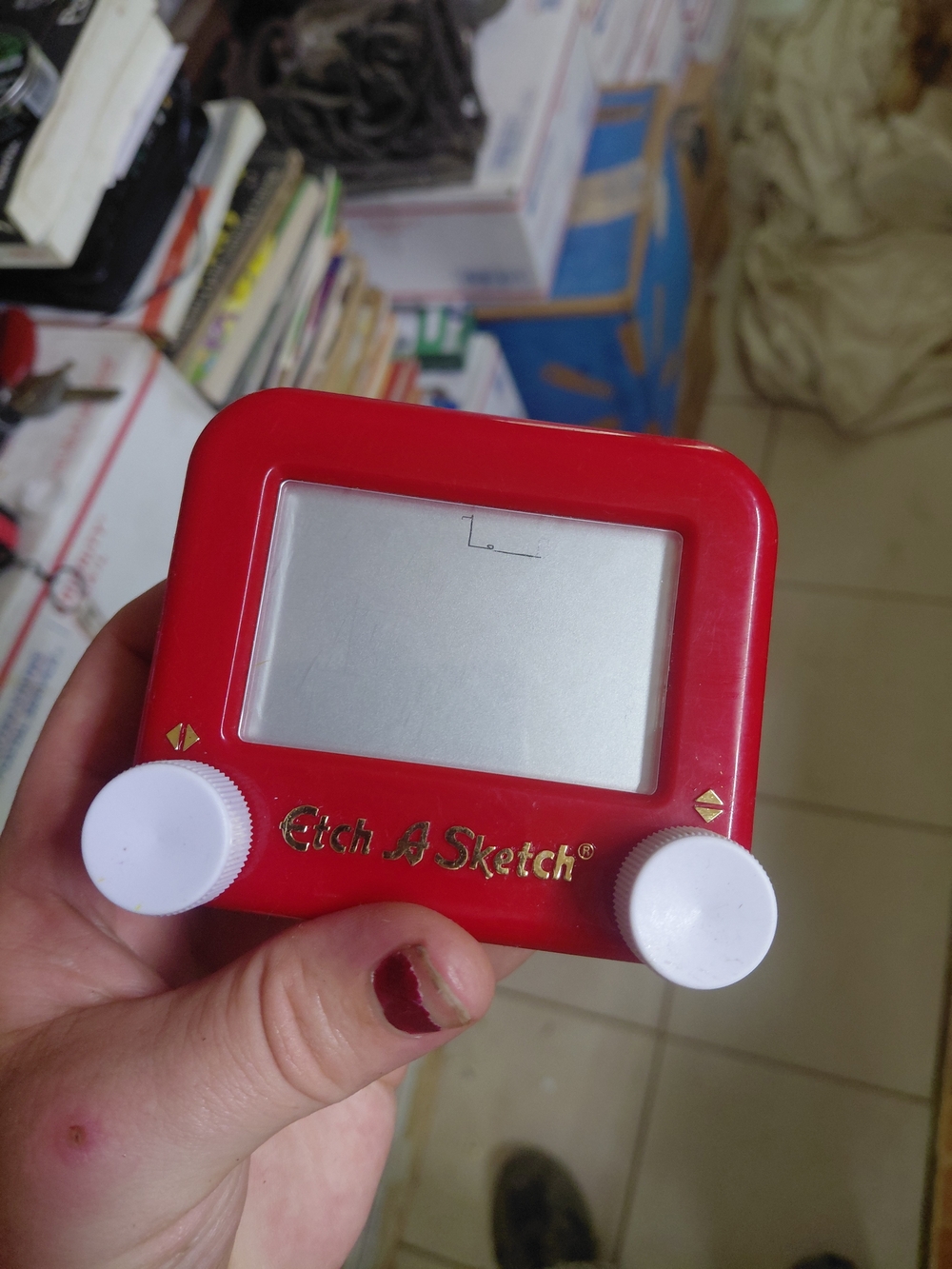 red Etch A Sketch Pocket mechanical drawing toy featuring the classic